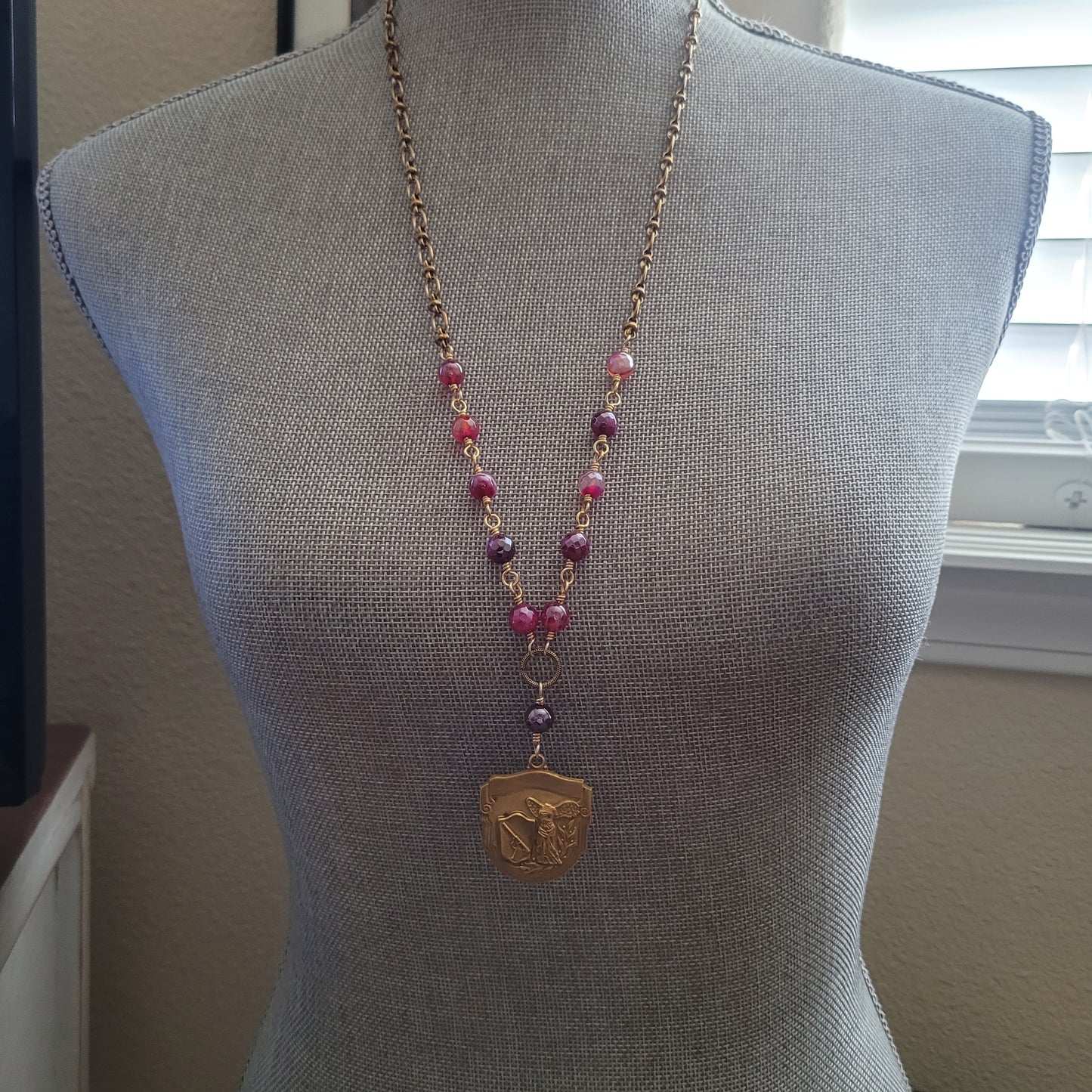Strength and Grace boho chic necklace, vintage shooting medal with angel statue, pink mystic agate beads