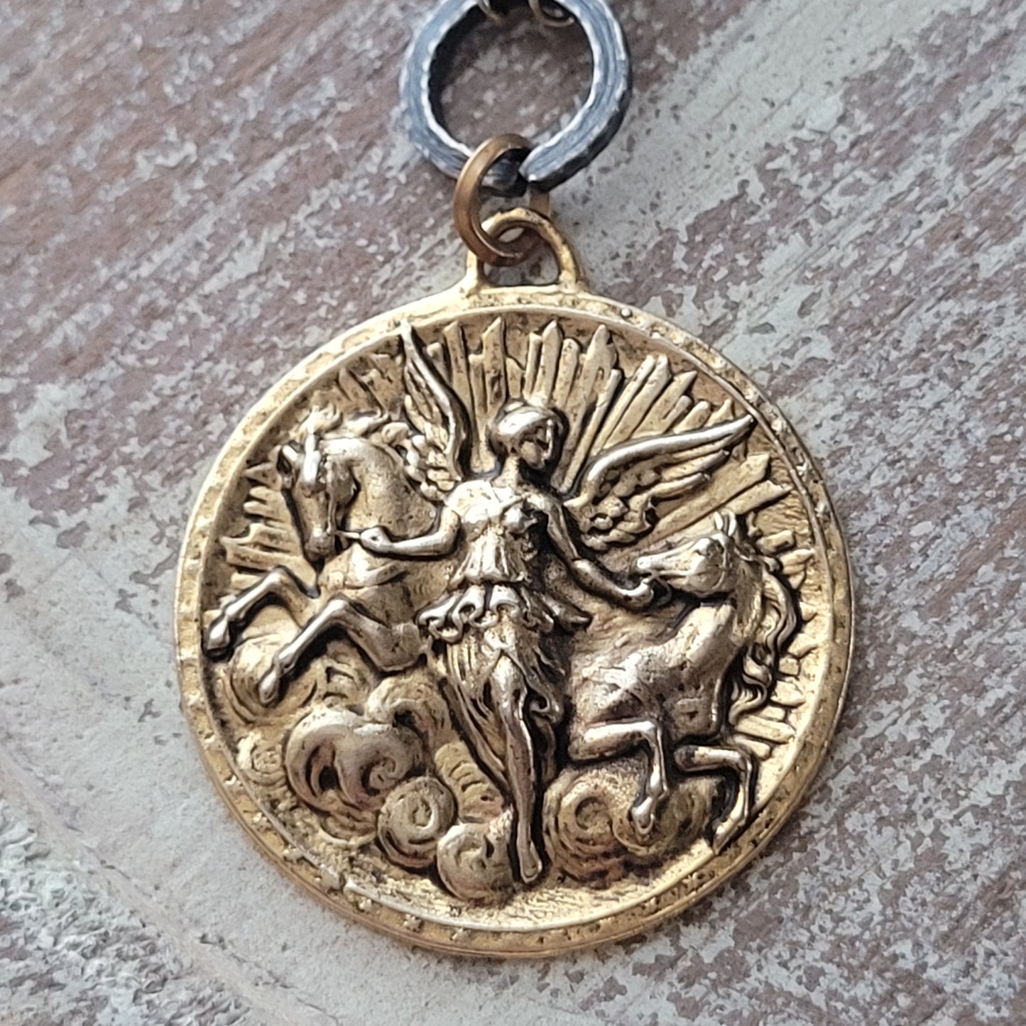 Angel Riding Horses necklace